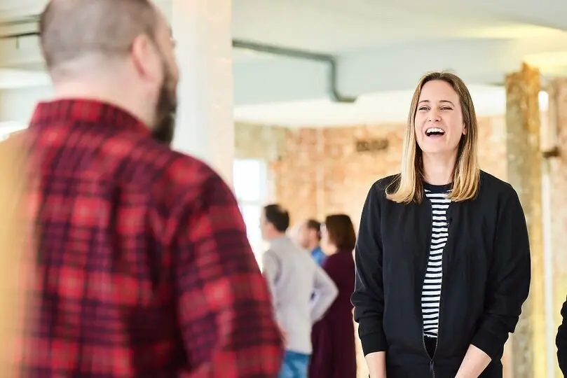 Facilitator smiling during a live DISC learning session