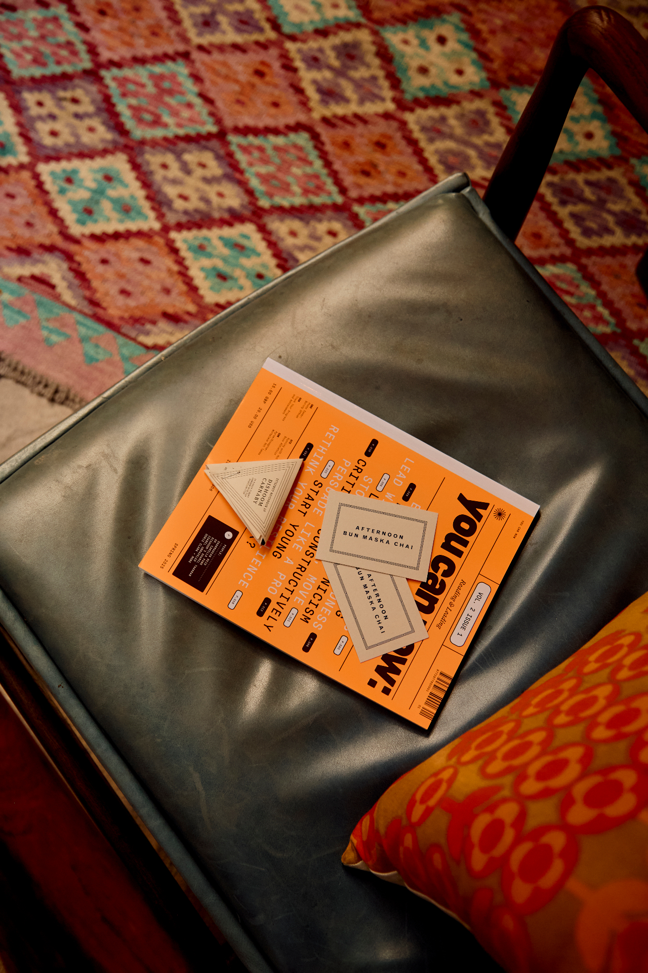 you can now: magazine on a leather chair at Dishoom