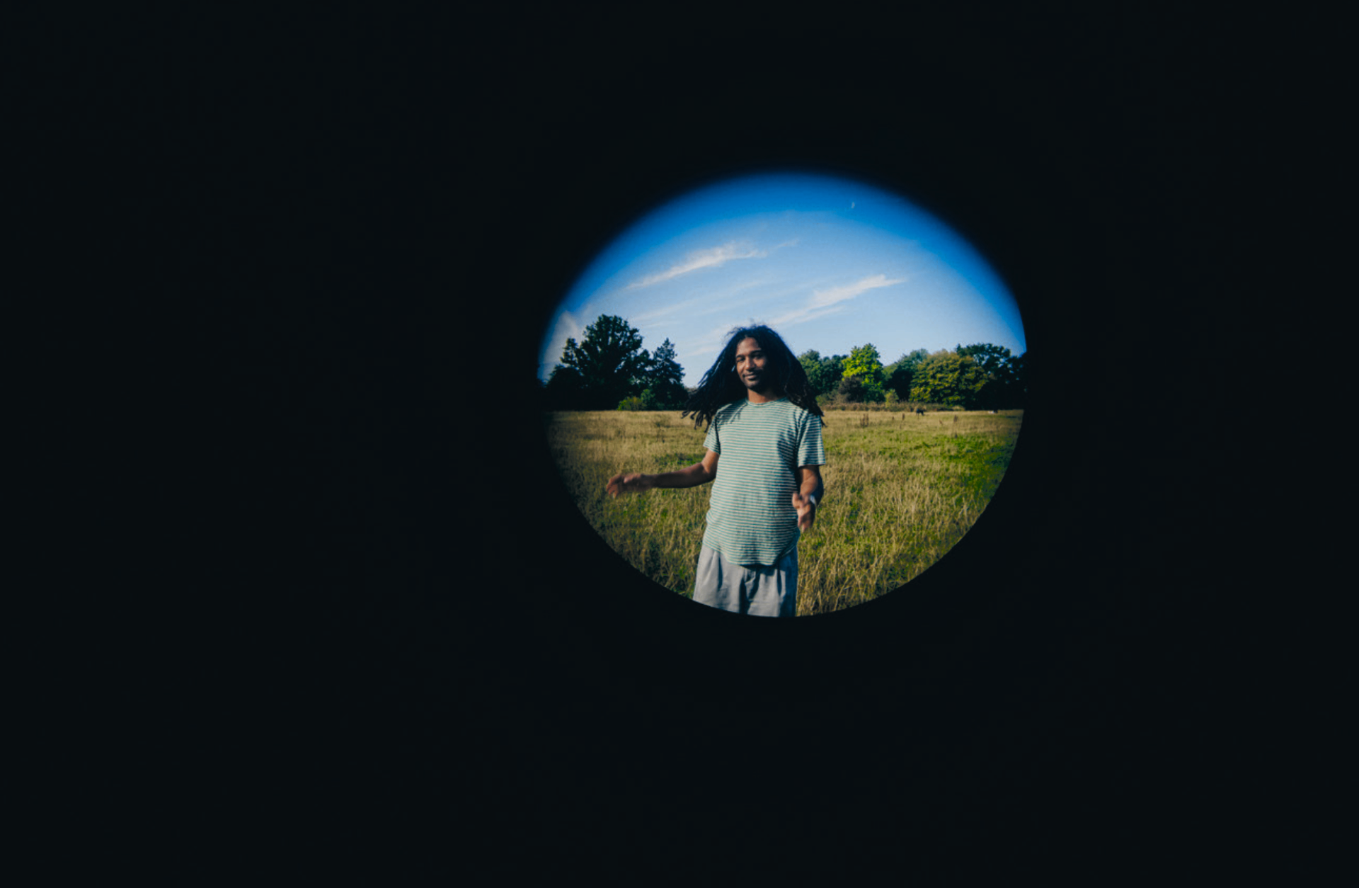 Nadeem seen through a fisheye lens vignette in a field