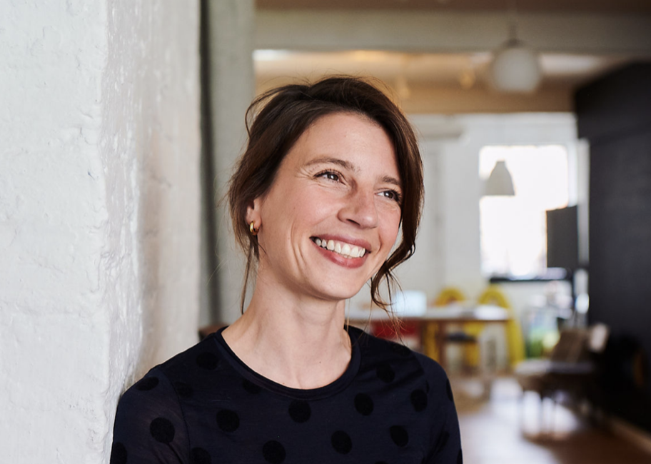 YCN coach-facilitator smiling in a studio setting