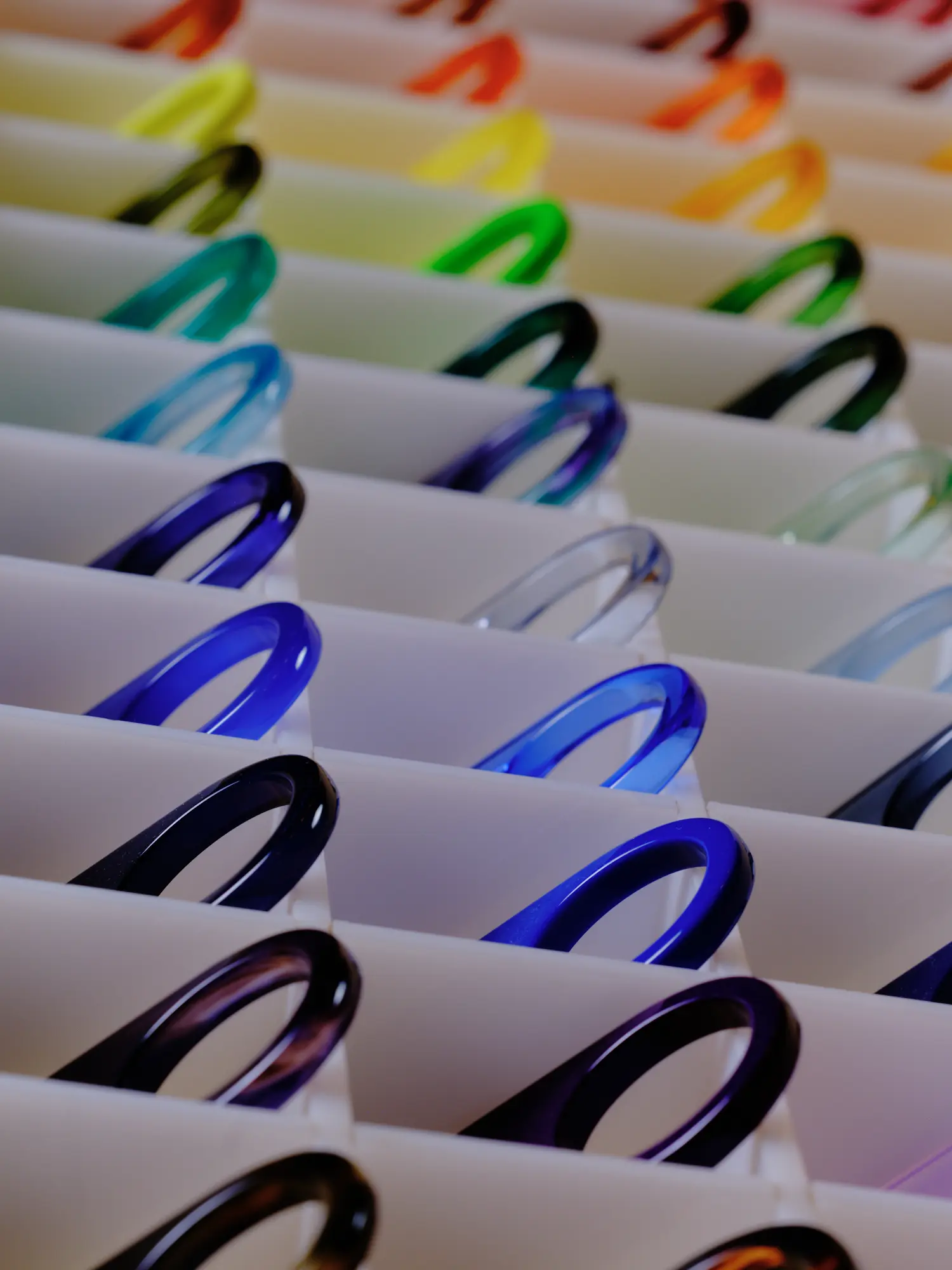 Rows of Cubitts acetate frames in a rainbow of colours