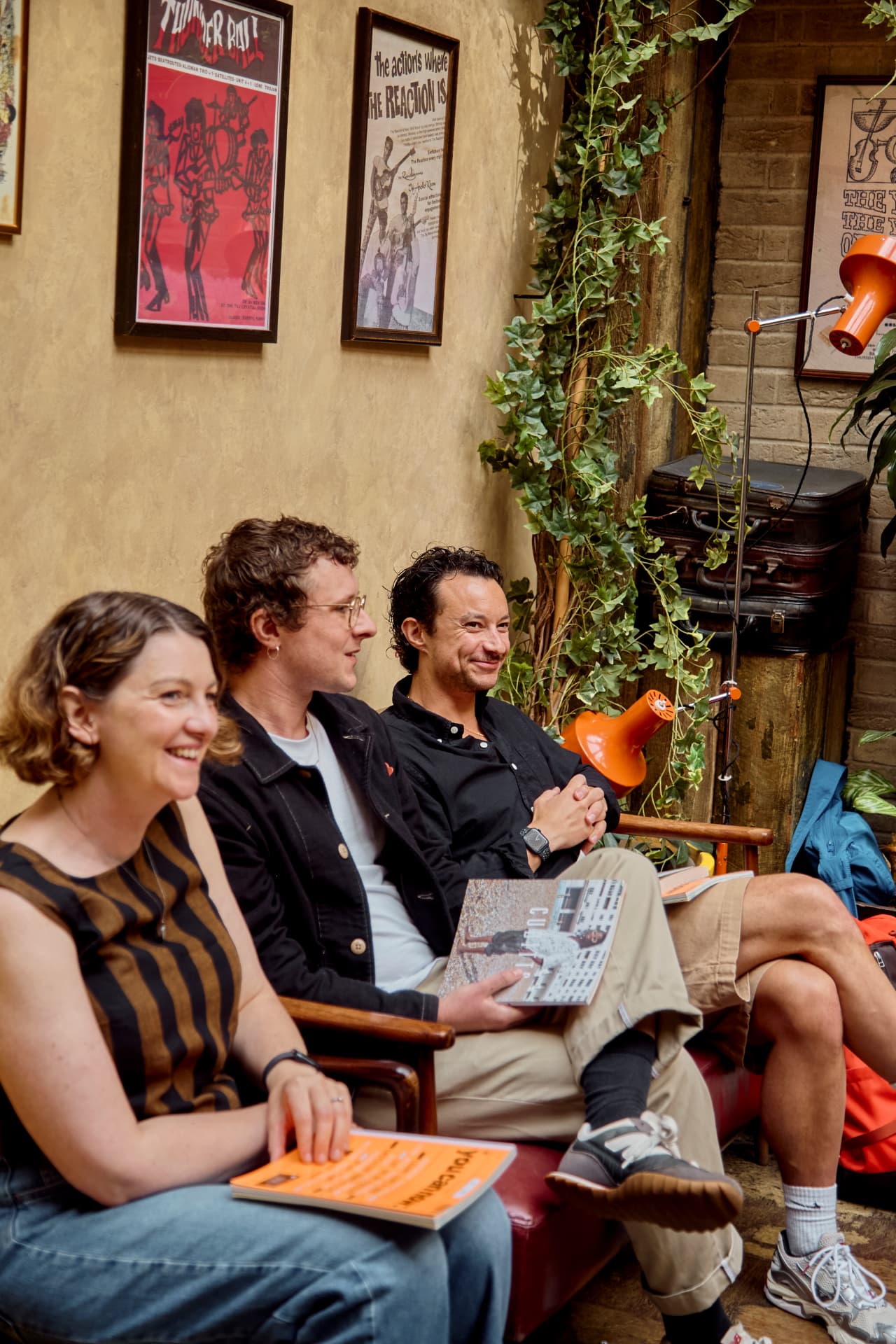 Three guests laughing during a breakfast session