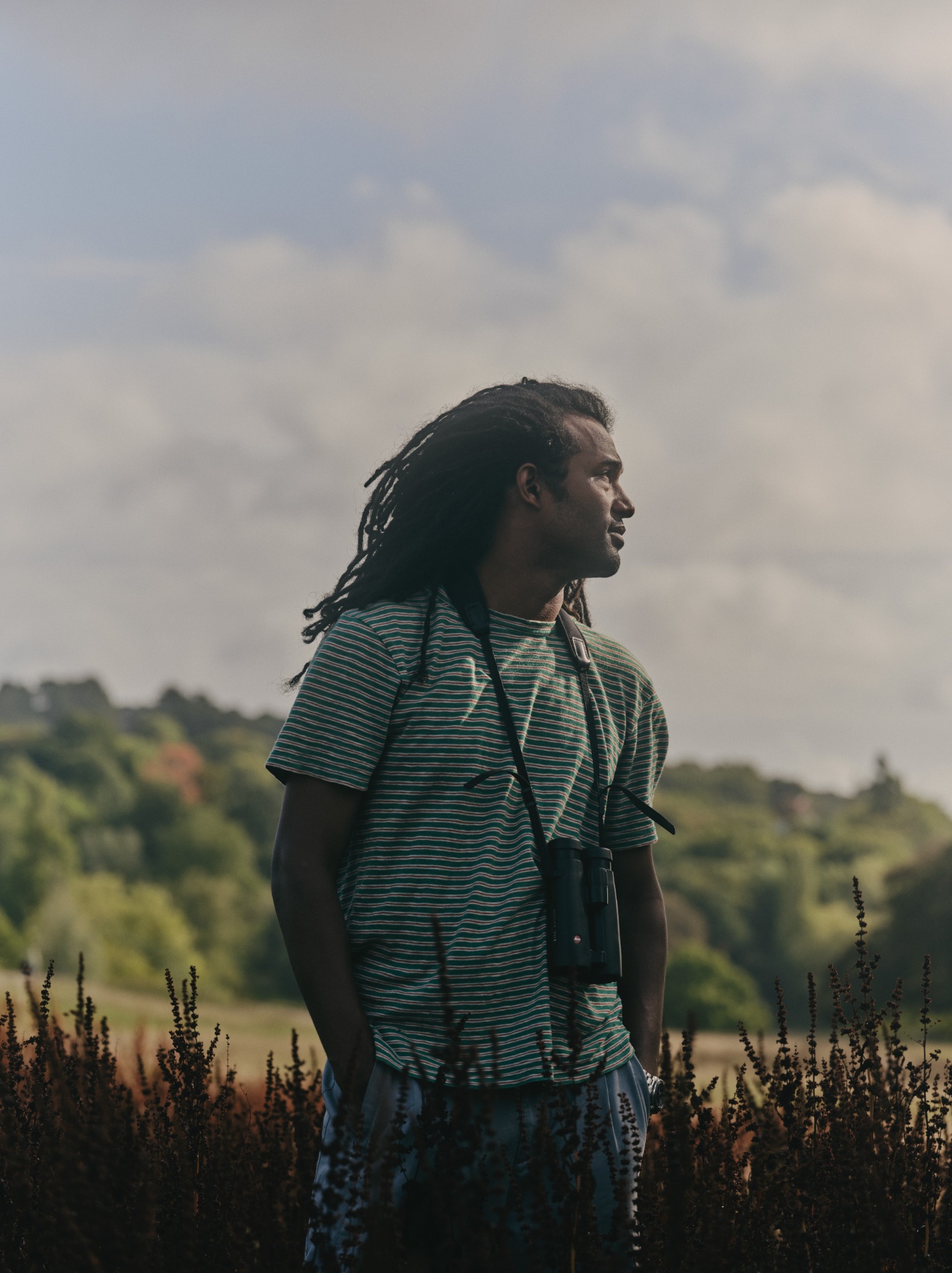 Nadeem Perera portrait with binoculars
