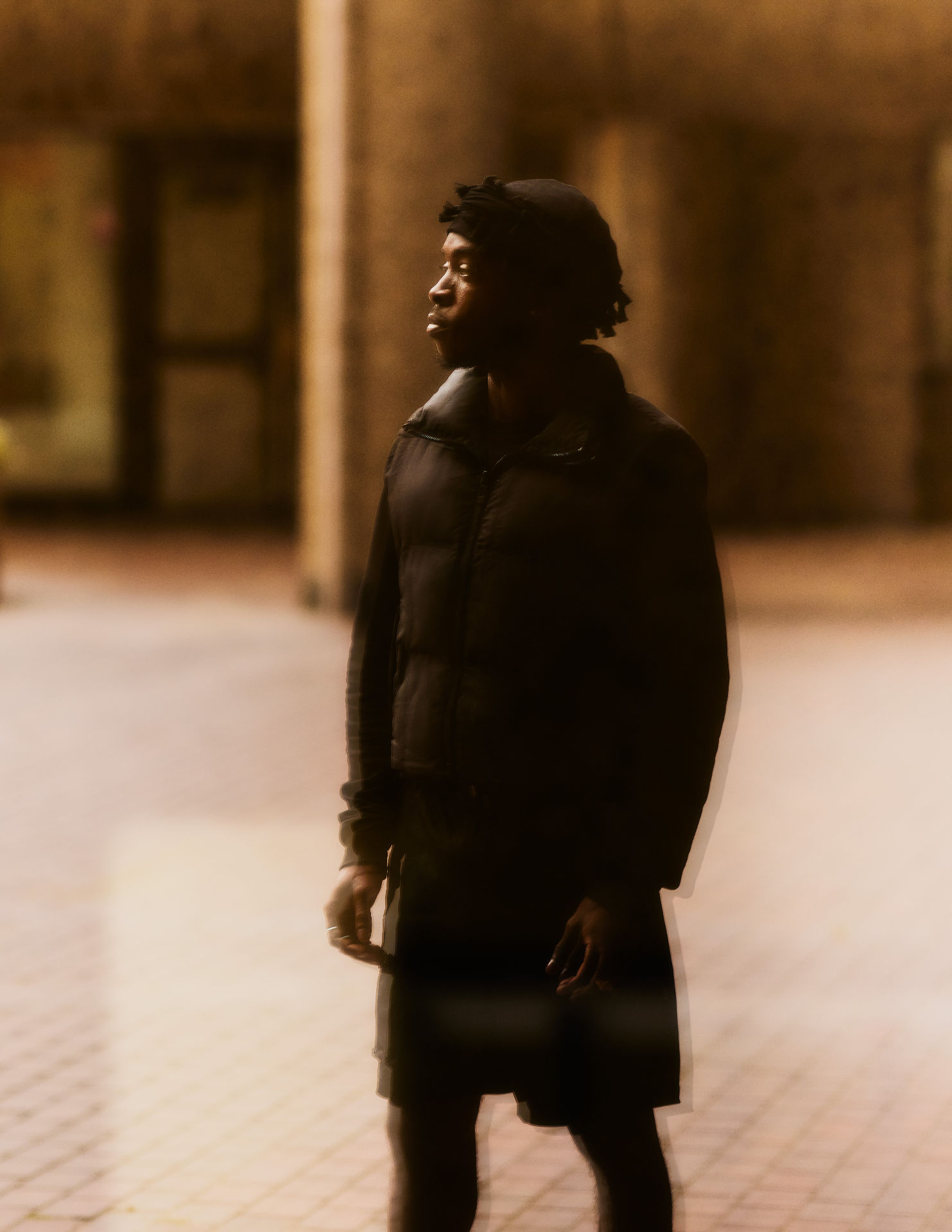 Javel Watt at dusk in an urban courtyard