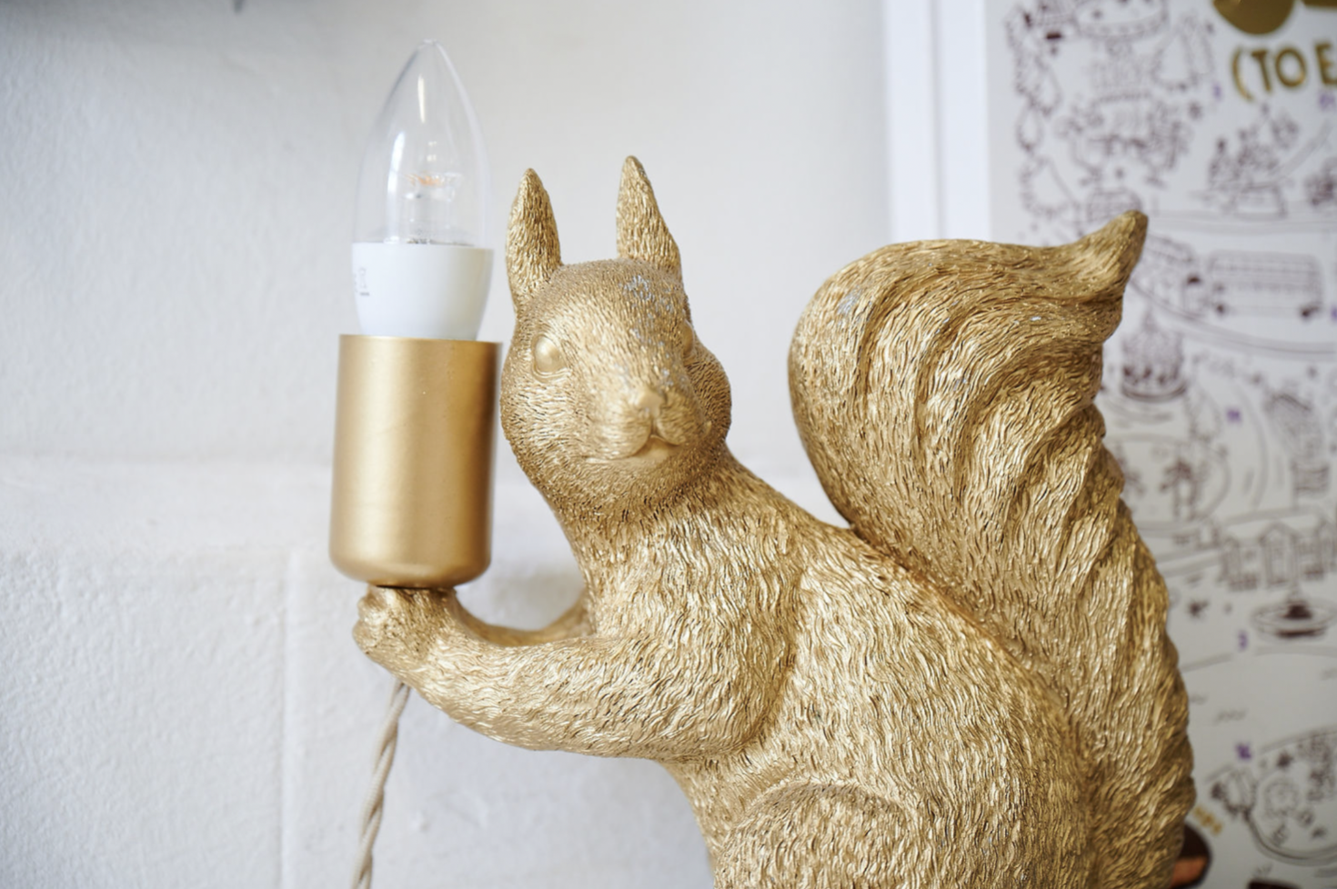 A golden squirrel lamp at Pip & Nut