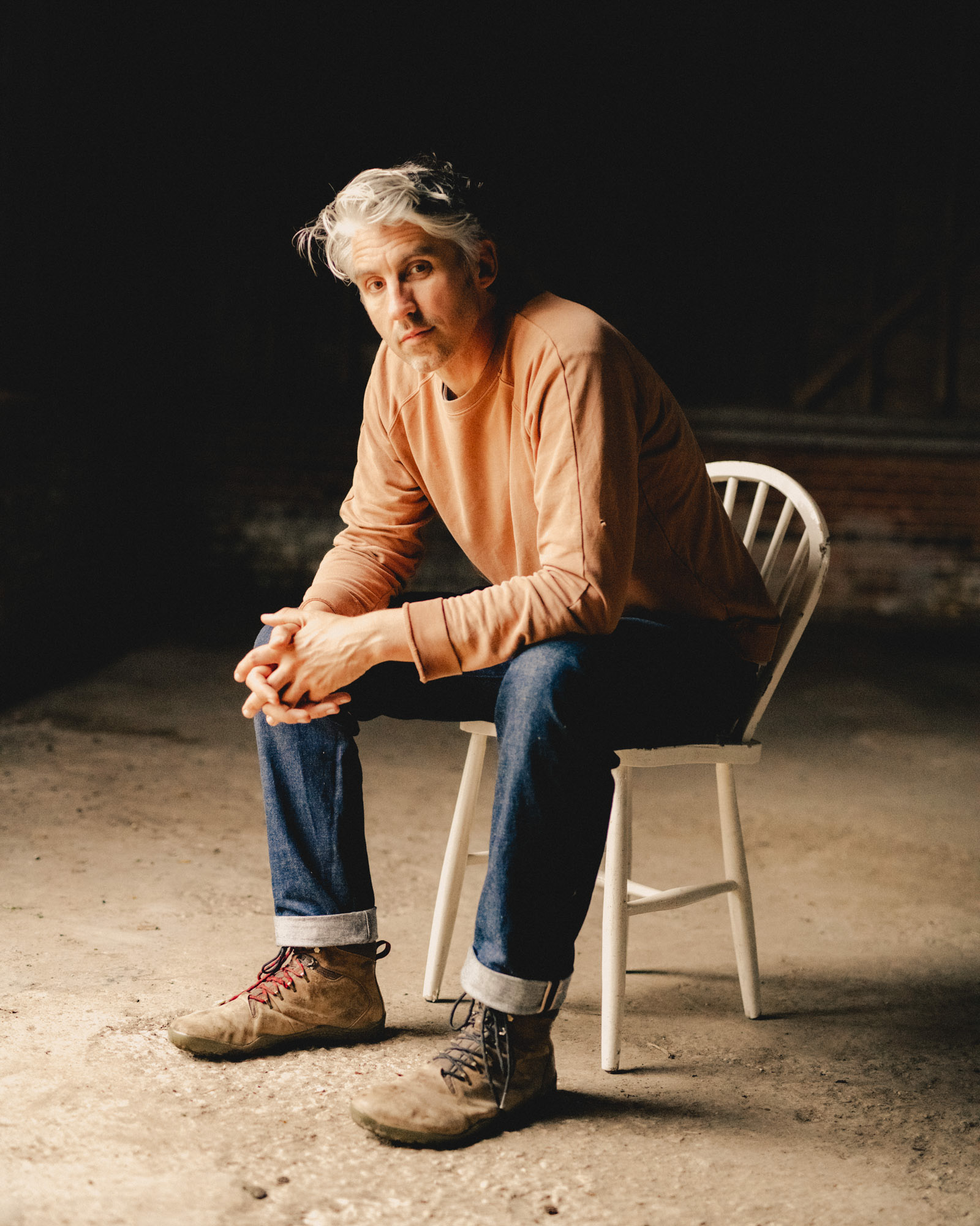 Portrait of a Wildfarmed co-founder in a barn interior