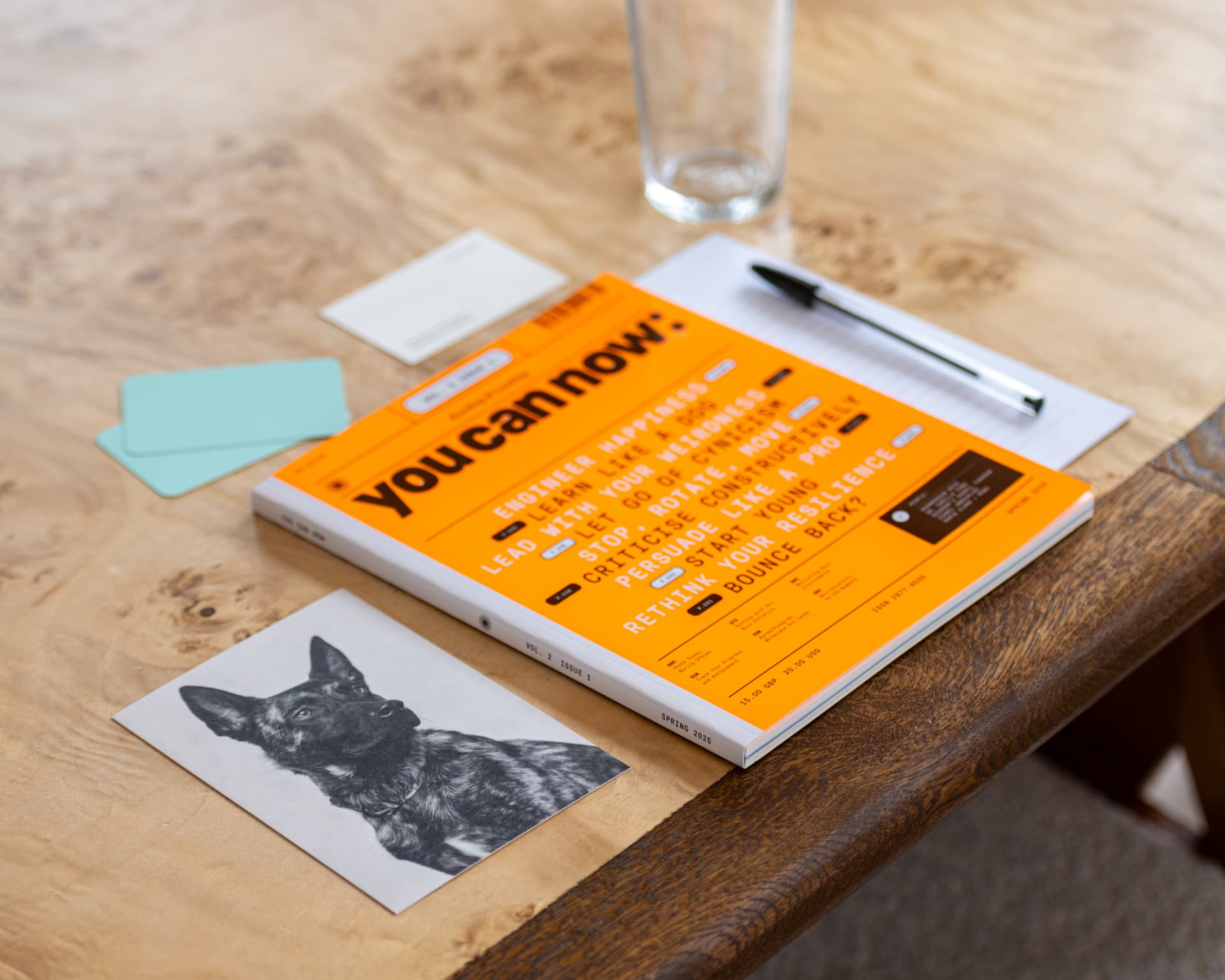 The latest issue of You Can Now on a table with notes and a pen